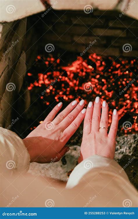 A Man Warms His Hands By The Fireplace Stock Image Image Of Hand