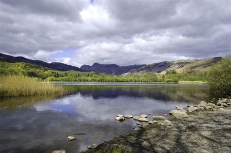 A View Of Calm Elter Water In The Lake District In Cumbria Stock Photo