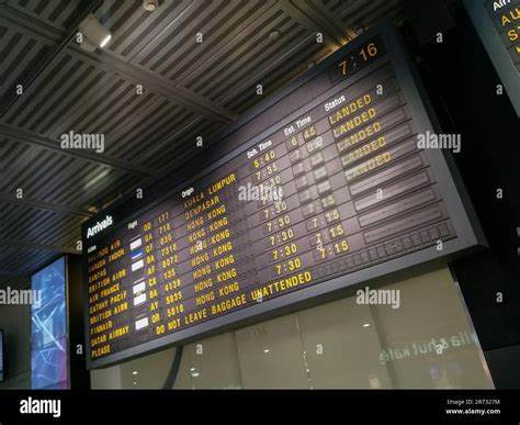 An arrivals sign at an airport terminal Stock Photo - Alamy