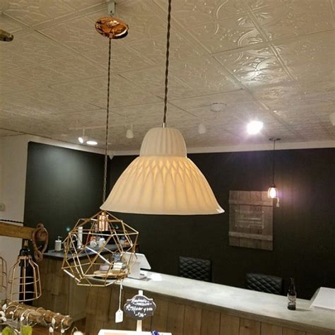 A Table With Some Food On It And A Lamp Hanging From The Ceiling