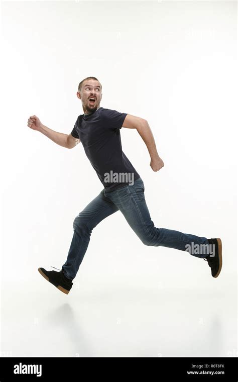 Man Running Fast At White Studio Background Stock Photo Alamy