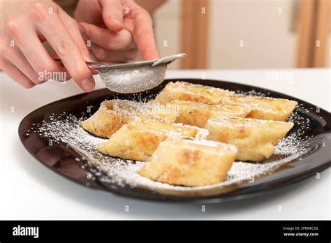 Chef Sprinkles Icing Sugar On The Apple Roll Strudel Feed Stock Photo