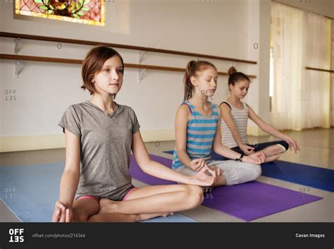 Three Young Teens In Seated Yoga Position Stock Photo Offset