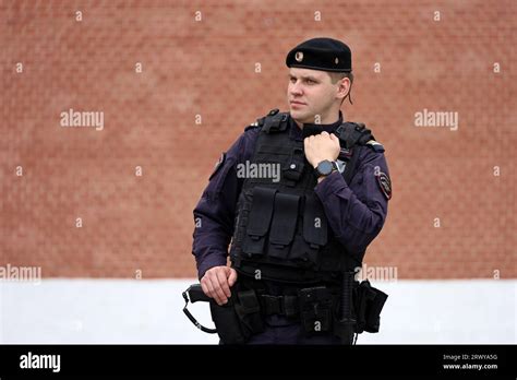 Russian Police Officer Of Special Forces In Bulletproof Vest Standing