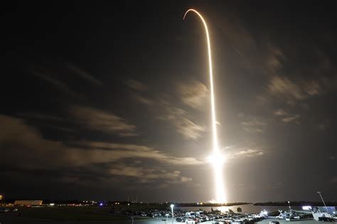 A Spacex Falcon 9 Rocket With The Crew Dragon Capsule Is Launched