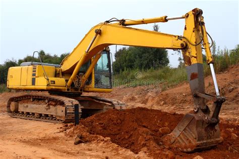 Excavator Digging Up Some Ground And Rocks #2 Stock Photo - Image of ...