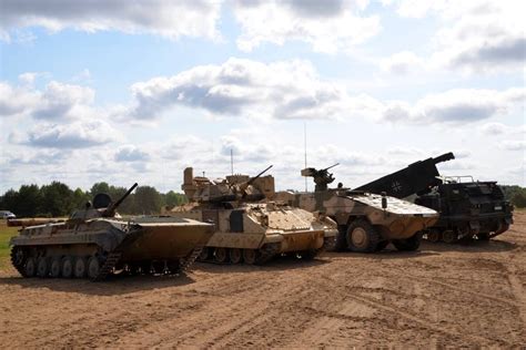 BMP 1, M2 Bradley, Boxer and an M270 MLRS next to each other. : r/TankPorn