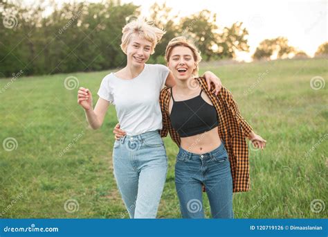 Two Young Women Having Fun On The Field Stock Photo Image Of Freedom