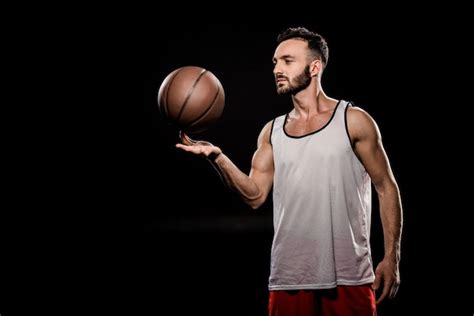 Premium Photo Handsome Basketball Player Spinning Ball On Finger