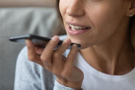 Close Up Woman Recording Voice Message Holding Phone Near Face Stock