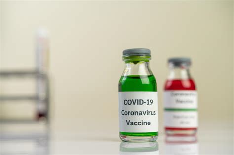 The vaccine against covid-19 in red and green bottles 1900456 Stock ...