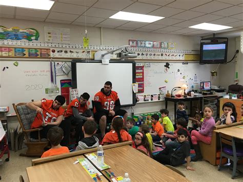 Dearborn High School Varsity Football Players Join the March is Reading Month Activities ...