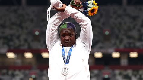 USA shot put medalist Raven Saunders raises hands in podium demonstration | NBC Olympics