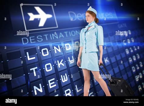 Composite Image Of Pretty Air Hostess Pulling Suitcase Stock Photo Alamy