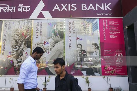 Pedestrians Walk By An Axis Bank Ltd Branch In Mumbai India On