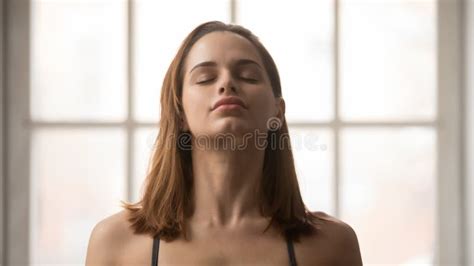 Portrait Of Beautiful Woman Meditating With Closed Eyes Practicing