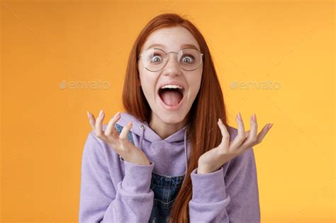 Shocked Excited Overwhelmed Young Screaming Happy Redhead Girl Wearing Glasses Winning Hear