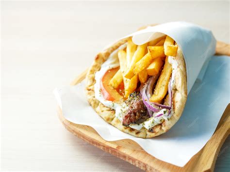 Premium Photo | Gyros on a restaurant table