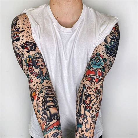 A Man With Many Tattoos On His Arms