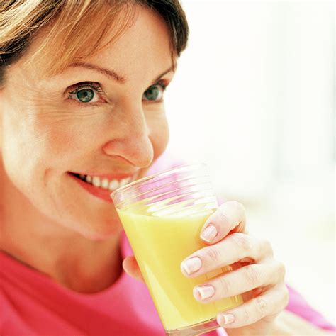 Drinking Orange Juice Photograph By Ian Hooton Science Photo Library