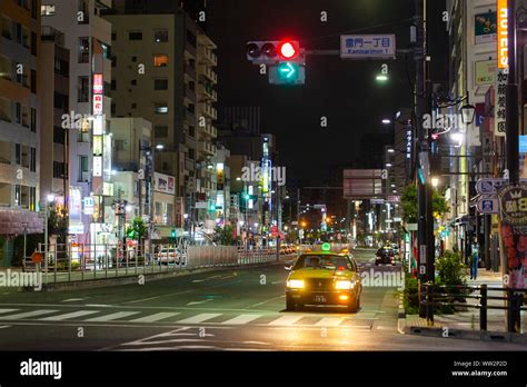 View of city street at night Stock Photo - Alamy