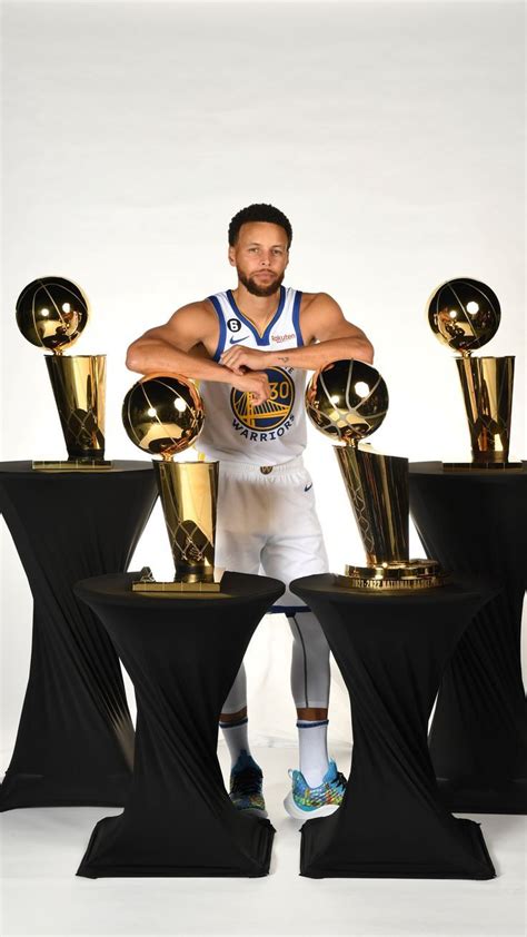 The Golden State Warriors Stephen Curry Poses With His Trophies