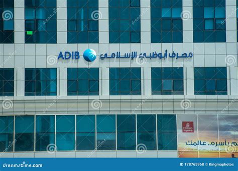 Abu Dhabi Islamic Bank ADIB Sign Close Up on a Glass Window Building ...