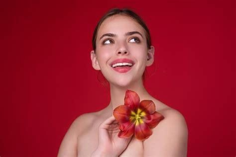 Premium Photo Dreaming Woman Beauty And Flower Girl With Tulip Near