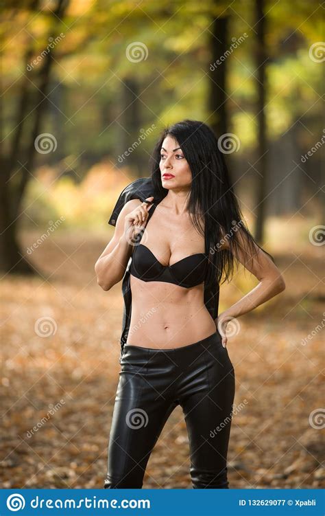 Beautiful Dark Haired Young Woman Wearing A Black Bra Leather Jacket