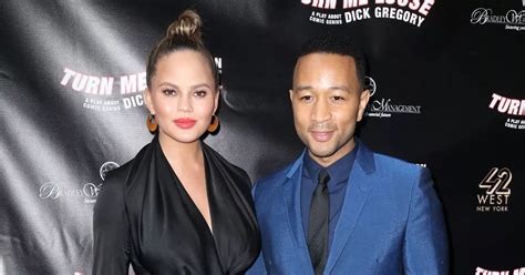 Chrissy Teigen Poses Completely Naked As She Sits Behind Husband John