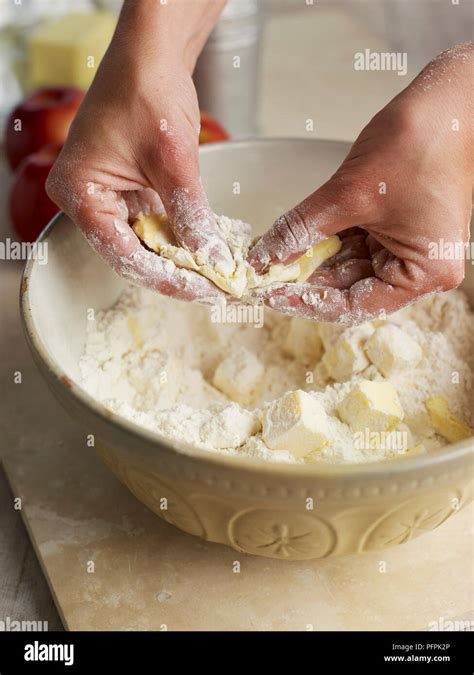 Rubbing Butter Into Flour Using Fingertips Making Pie Pastry Stock