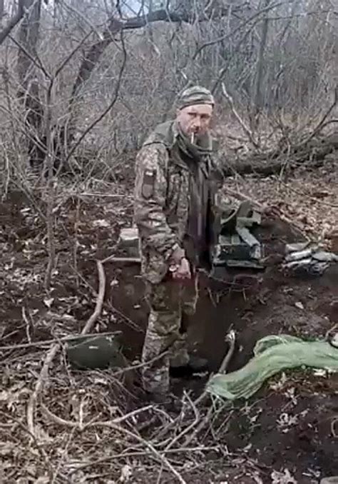 Screenshot Of A Video Of Ukrainian Soldier Oleksandr Matsiyevsky Standing In A Grave He Was