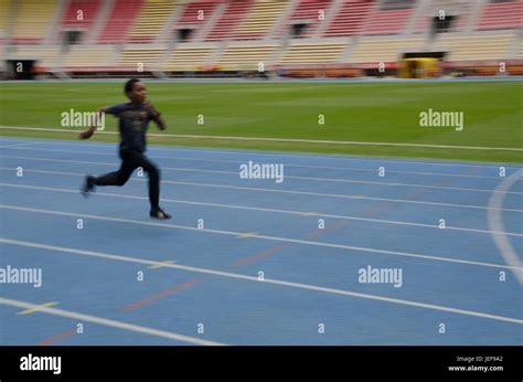 Child running track hi-res stock photography and images - Alamy