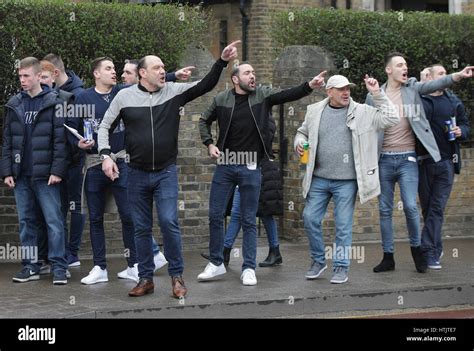 Millwall fans gesture towards Tottenham fans prior to the Tottenham ...