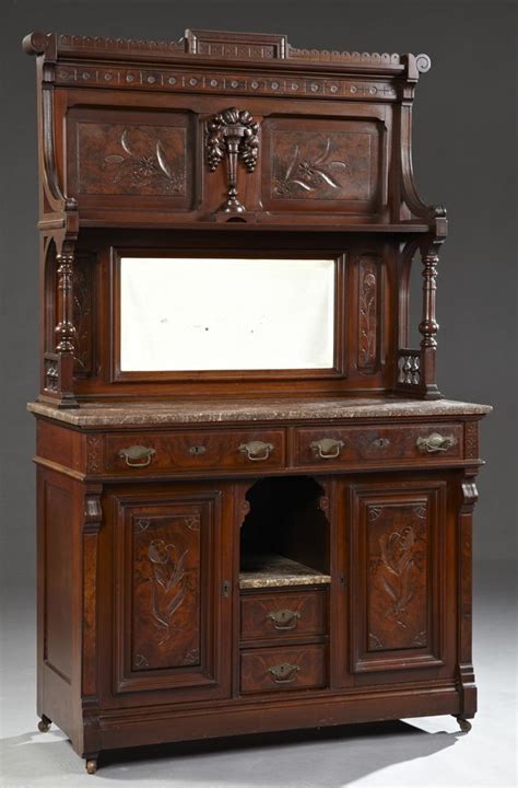 An Antique Wooden Dresser With Mirror On Top