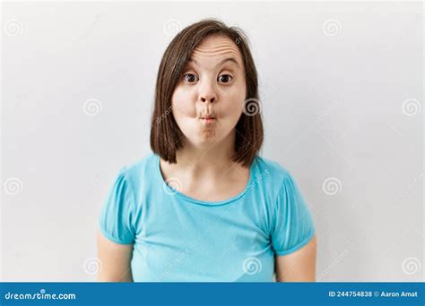 Young Down Syndrome Woman Standing Over Isolated Background Making Fish