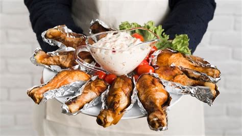 Free Photo Chef Holding Plate With Chicken