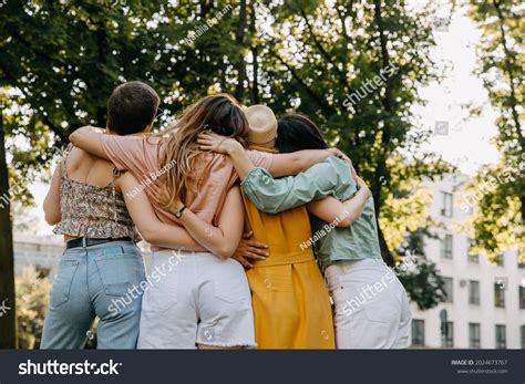 Group Four Women Friends Park Hugging Stock Photo 2024673767 Shutterstock