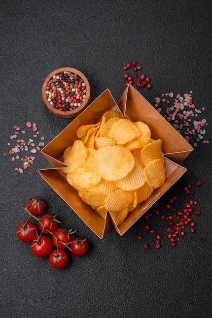 Premium Photo Crispy Potato Chips With Salt Spices And Herbs