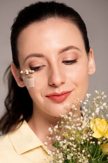 Premium Photo Woman With Band Aid Flower On Face