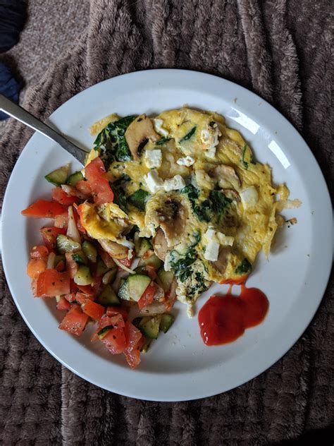 Delicious Feta Spinach And Mushroom Omelette With Salad For