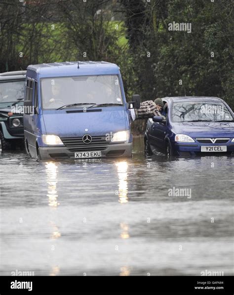 A Driver Is Rescued After His Car Became Trapped In Rising Floodwater