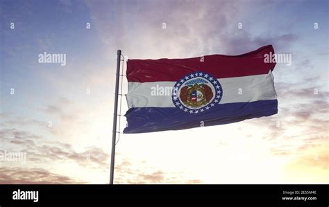 State Flag Of Missouri Waving In The Wind Dramatic Sky Background 3d