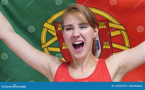 Portuguese Young Woman Celebrating While Holding The Flag Of Portugal