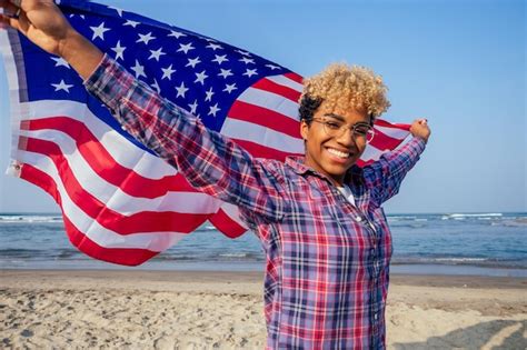 Premium Photo Happy Afro American Woman Holding Usa Flag At Sunny