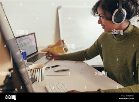 Female Programmer Working In Office Woman Looking At Laptop While