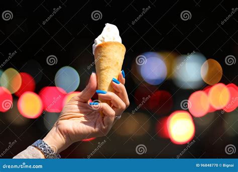 Hand Holding Ice Cream Cone With Bokeh Ligh Stock Photo Image Of