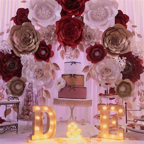 This Stunning Paper Flower Arch With Red Gold And Black Roses Is Just