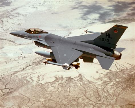 An Air To Air Left Rear View Of An F Fighting Falcon Aircraft In