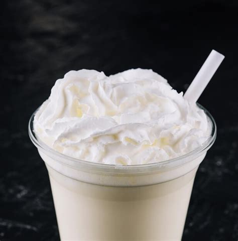 Premium Photo Glass With White Milkshake And Cream